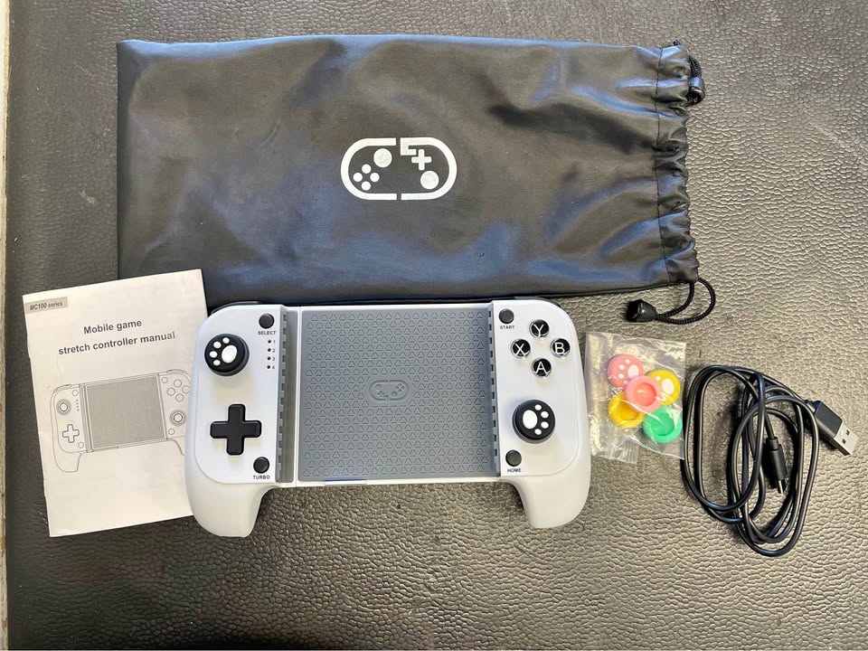 MC 100 PORTABLE GAME CONTROLLER, photo 1 of 3